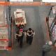 High angle view of warehouse workers organizing and preparing shipments with boxes and pallets.